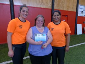 Kerrianne receives certificate at Life Fit class