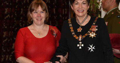 Genevieve stans alongside Dame Patsy Reddy inside Government House Ballroom